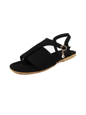 Black sandal with a decorative charm