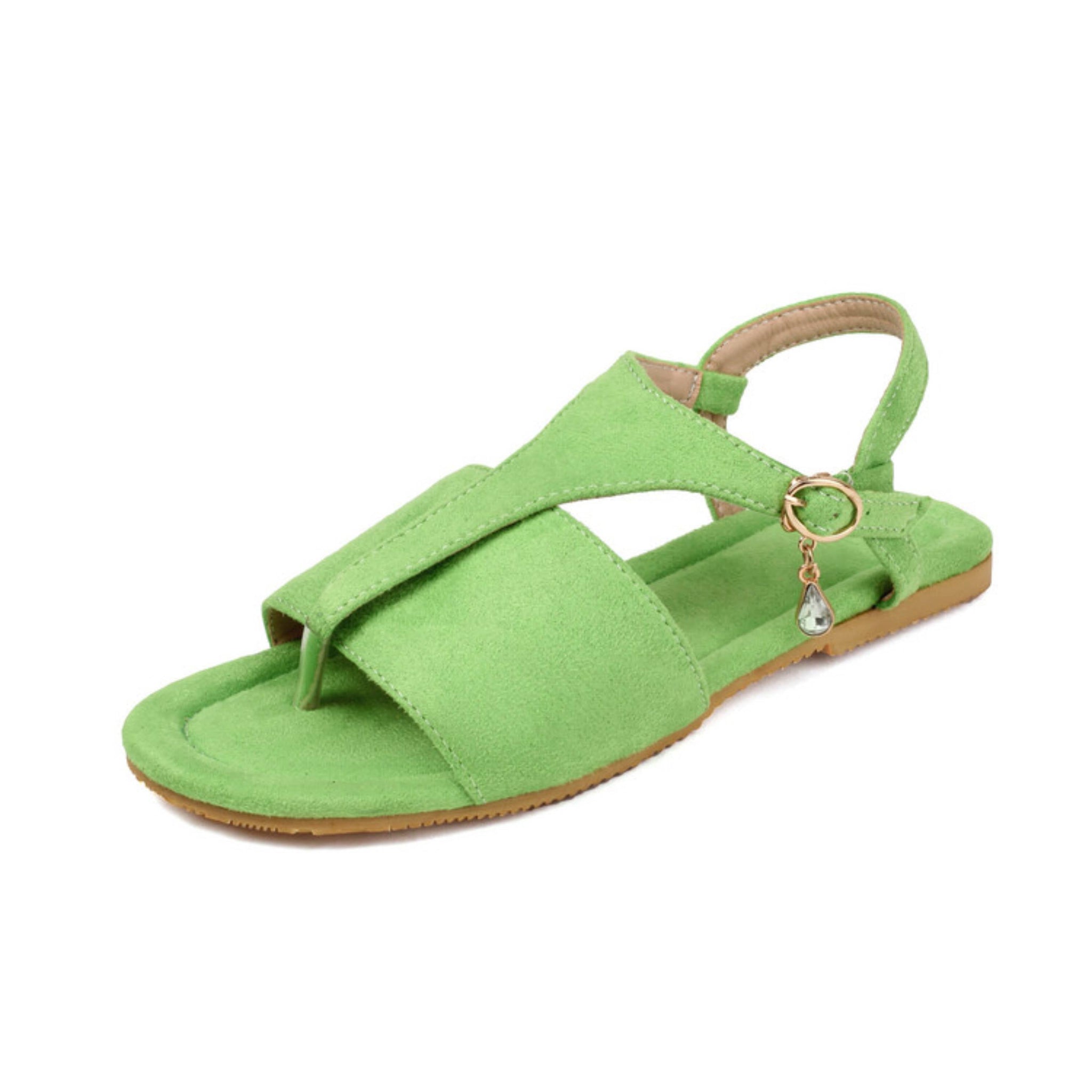 Green sandal with a decorative charm