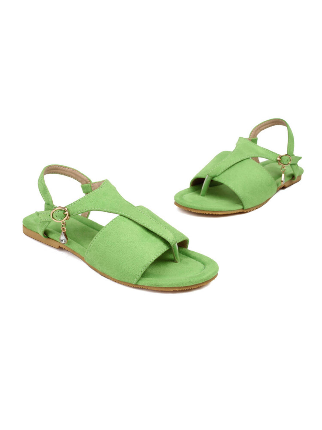 Green sandal with a decorative charm