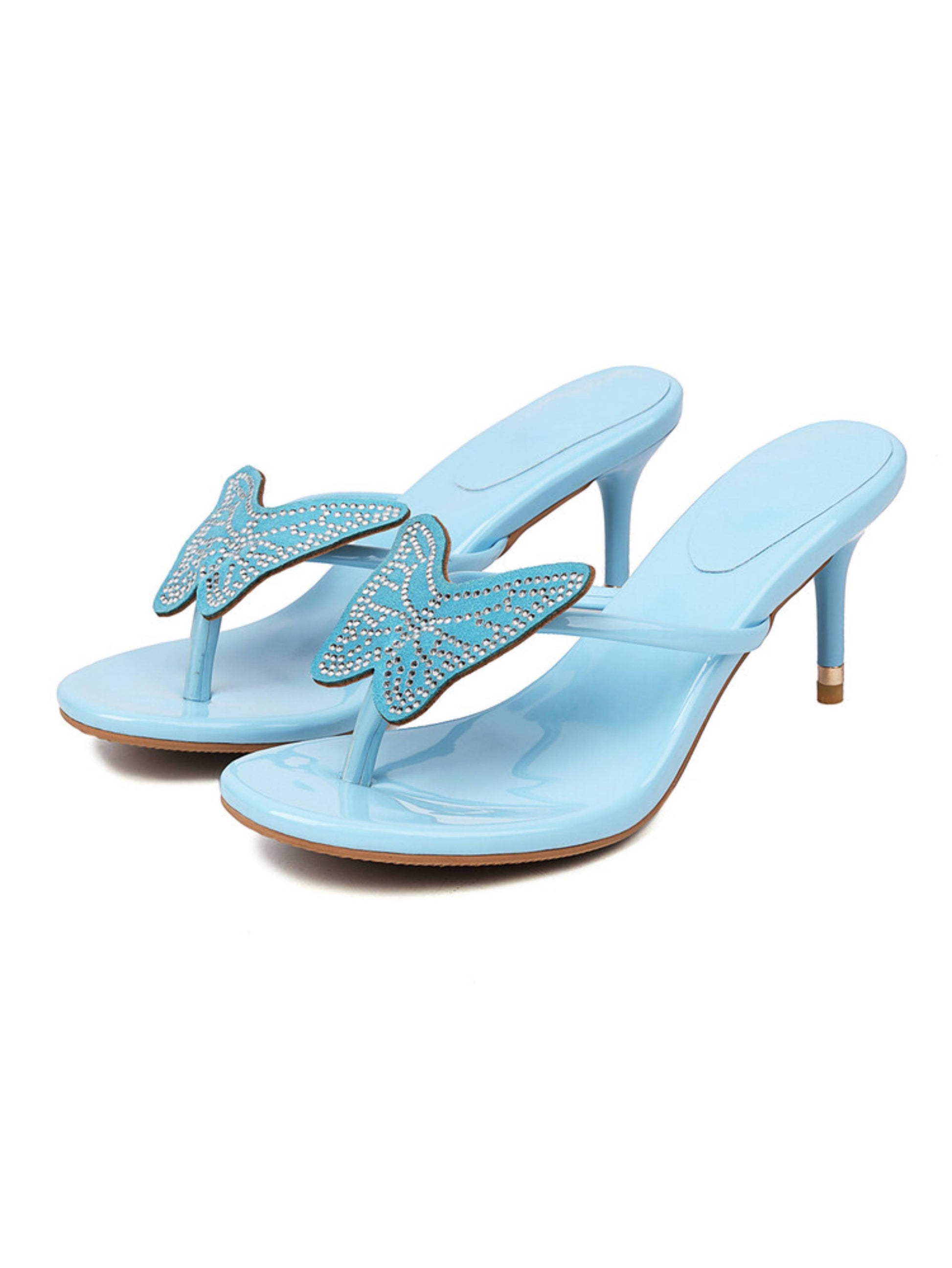 Pair of light blue high-heeled sandals with butterfly design