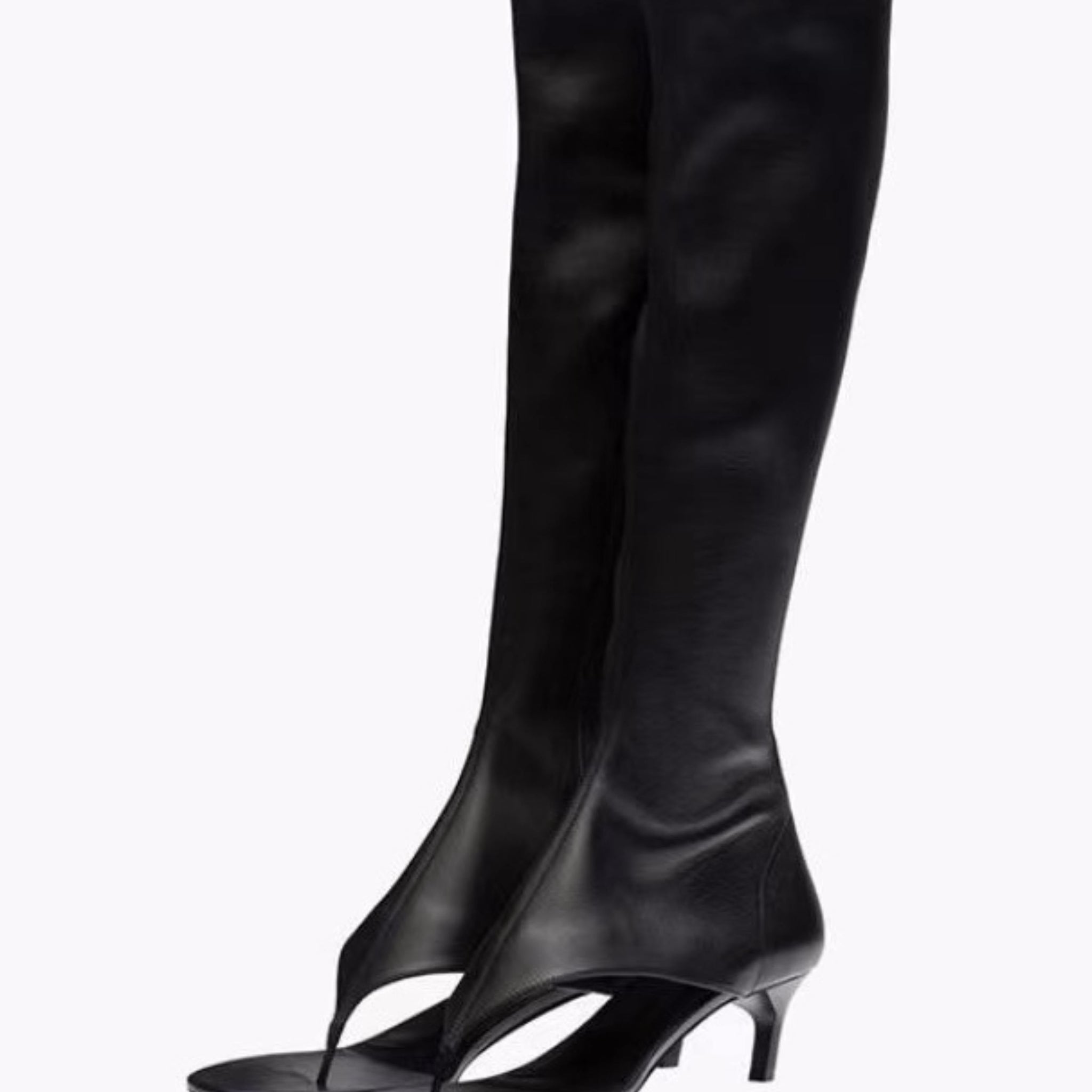 Black knee-high boots with open-toe design