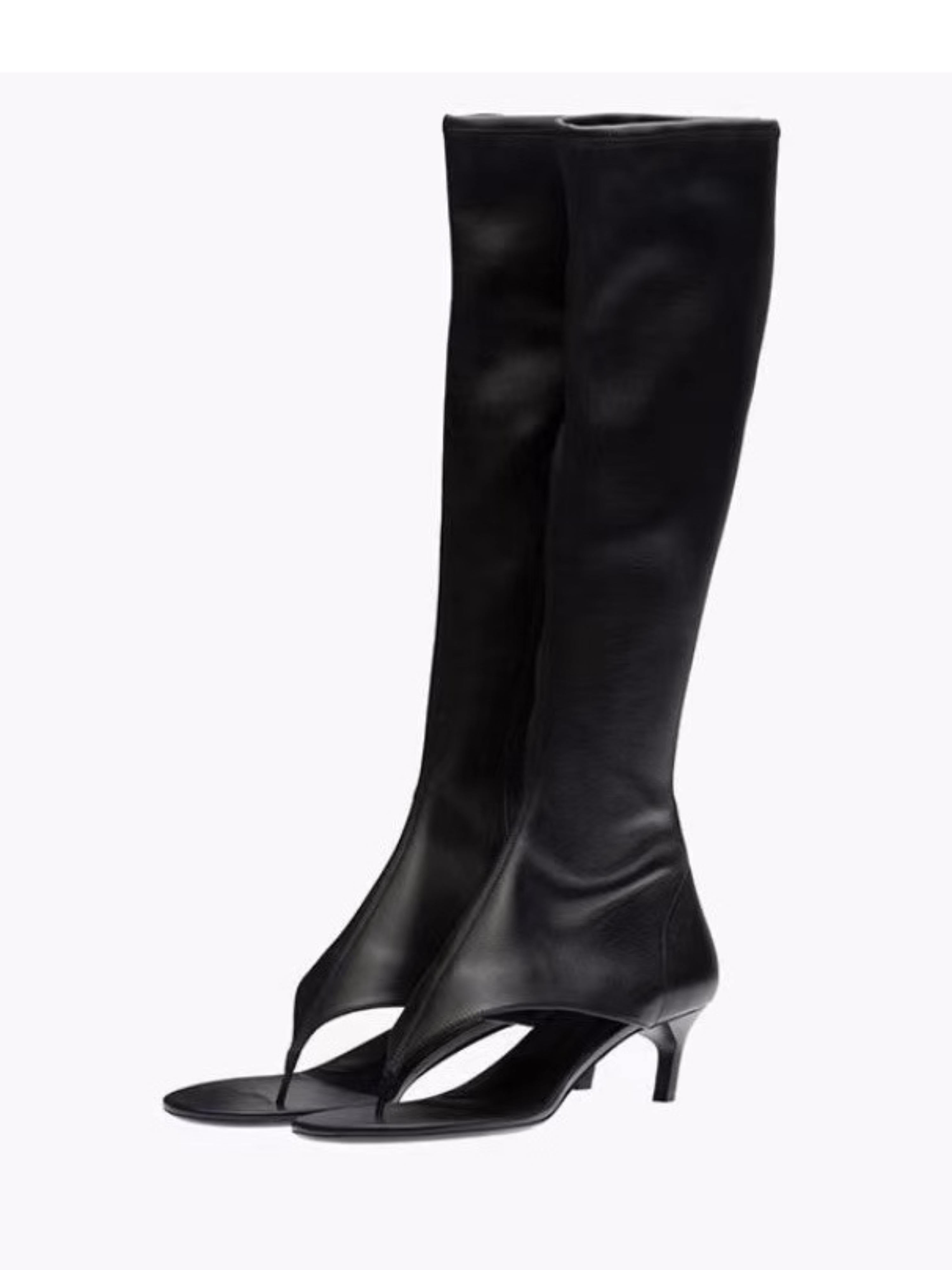 Black knee-high boots with open-toe design