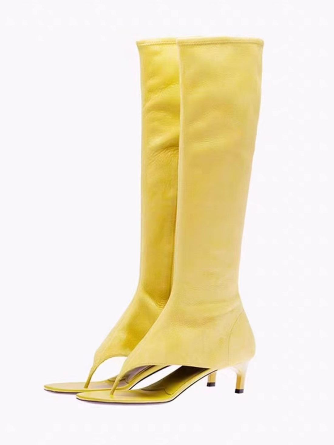 Yellow knee-high boots with thin straps