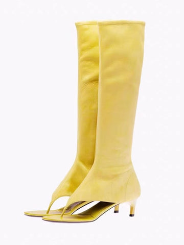 Yellow knee-high boots with thin straps