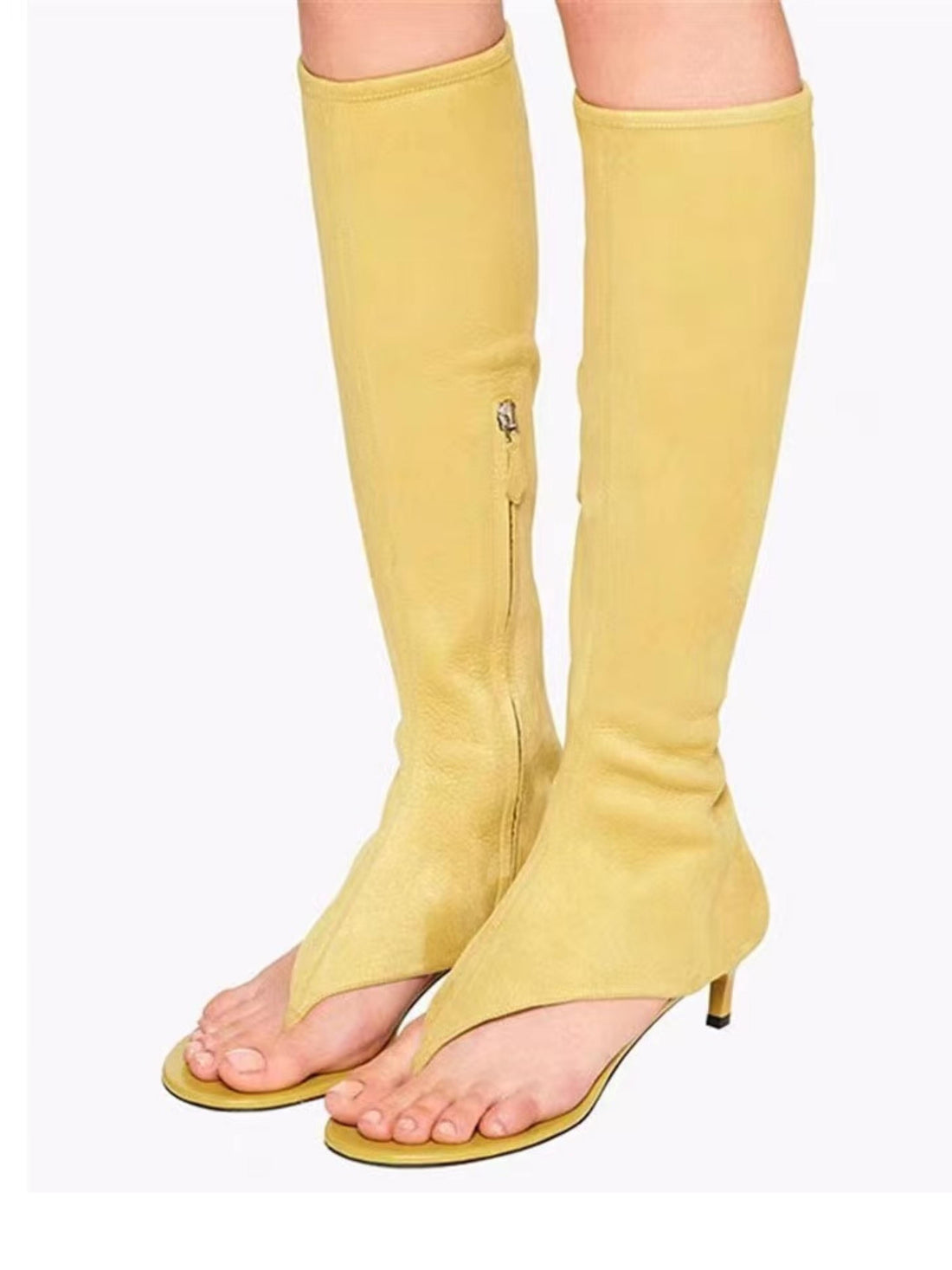 Yellow knee-high boots with thin straps