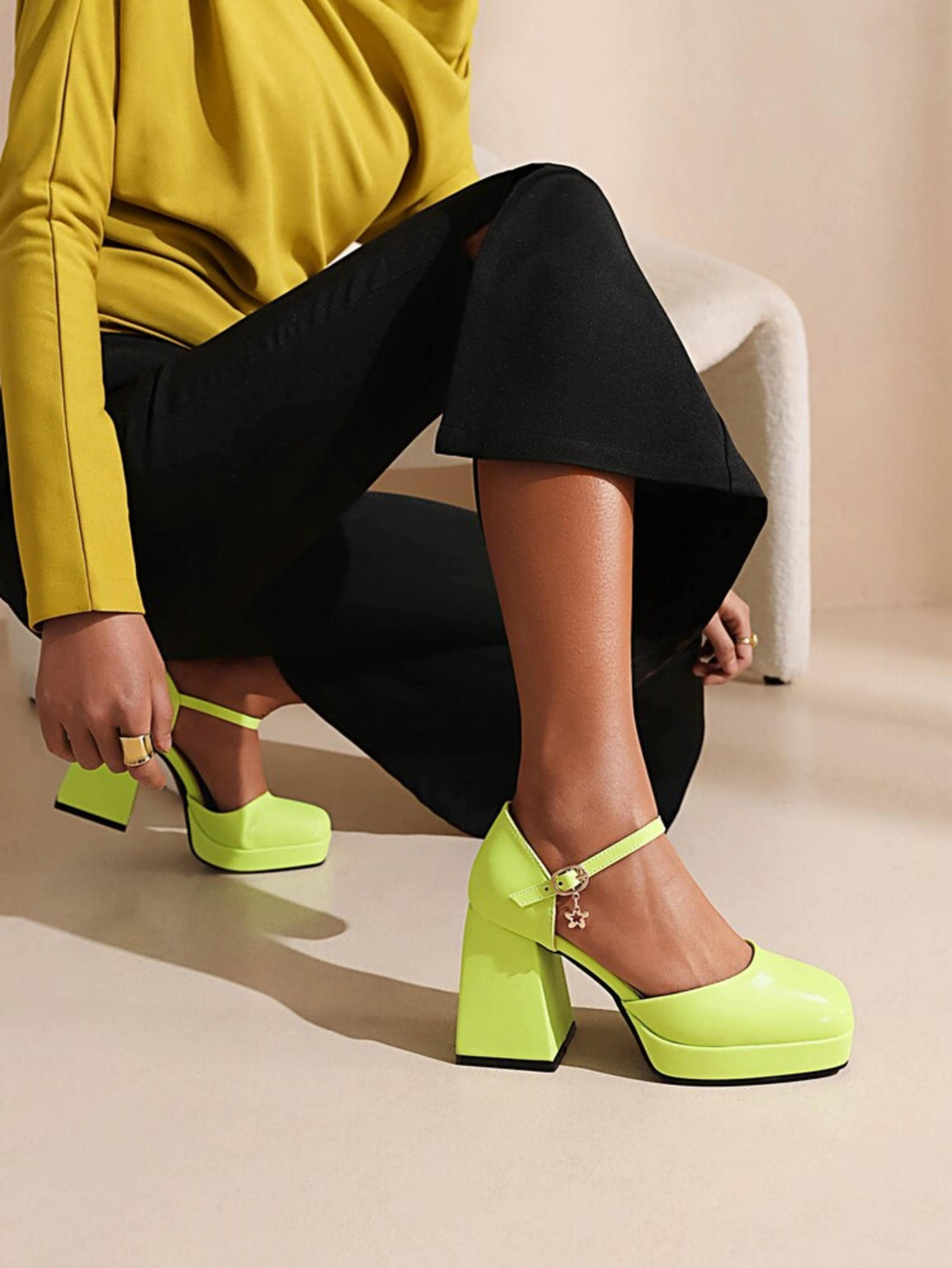 Neon green high-heeled shoe with a strap