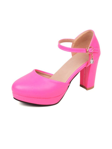 Neon pink high-heeled shoe with a platform
