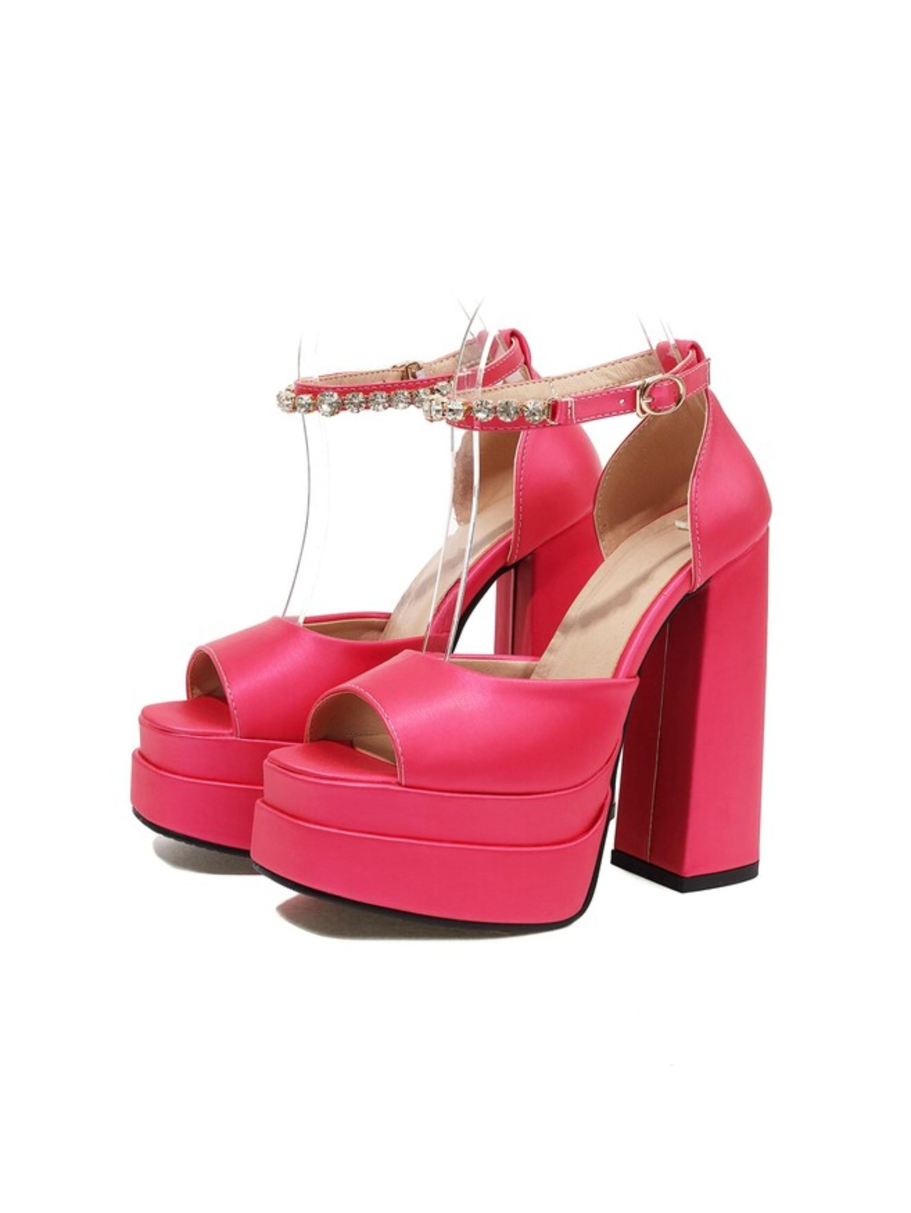 Pink high-heeled platform shoes with rhinestone straps